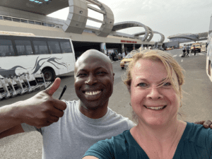 Two travelers smiling at the airport