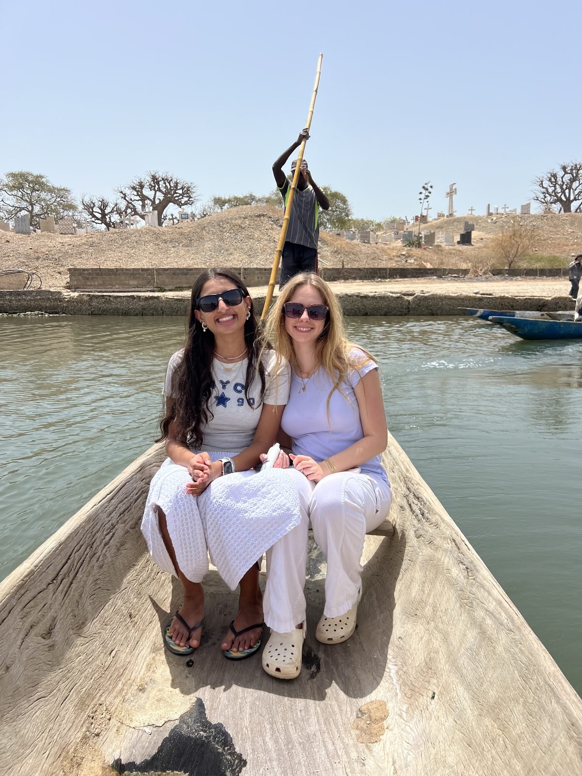 Students in a pirogue on the water at Fadiouth